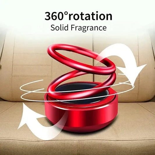 Solar-Powered Air Freshener-Red spiral fragrance diffuser on a beige surface with '360° rotation' text.
