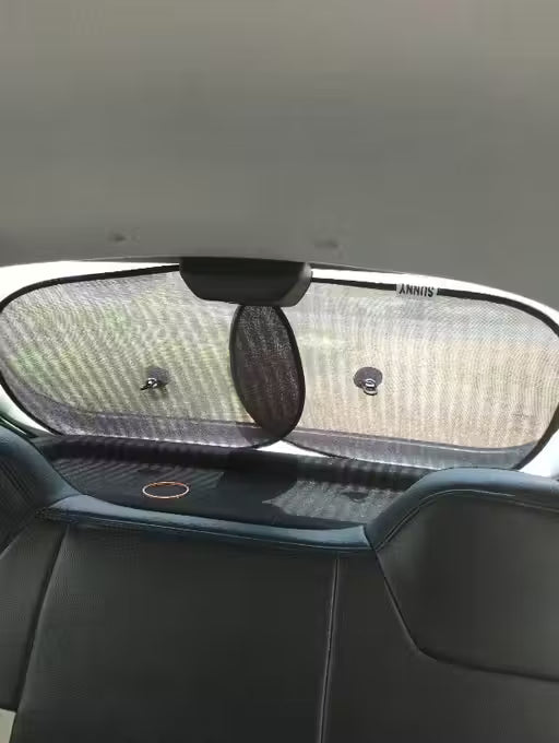 Window Sun Shade-Car sunshade on a car's windshield with a visible brand logo.