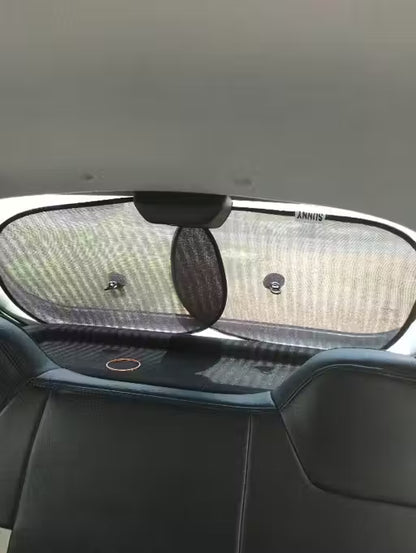 Window Sun Shade-Car sunshade on a car's windshield with a visible brand logo.