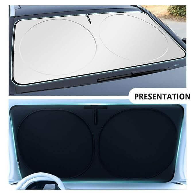 Folding car window sunshade cover blocking sunlight, keeping car interior cool in summer.