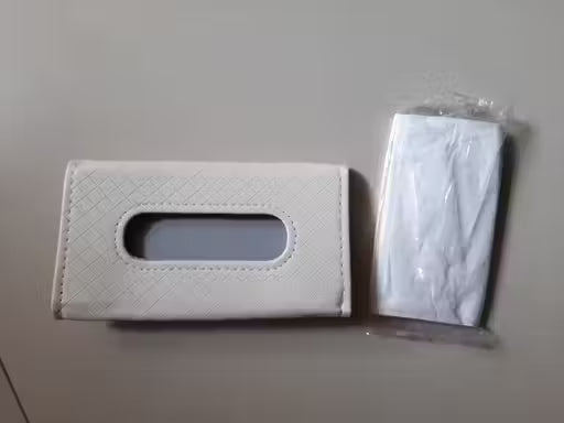 Luxury Car Tissue Paper Holder-White textured tissue box cover with a clear plastic bag on a gray background