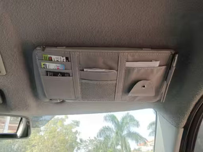 Car visor organizer with multiple compartments on a car dashboard