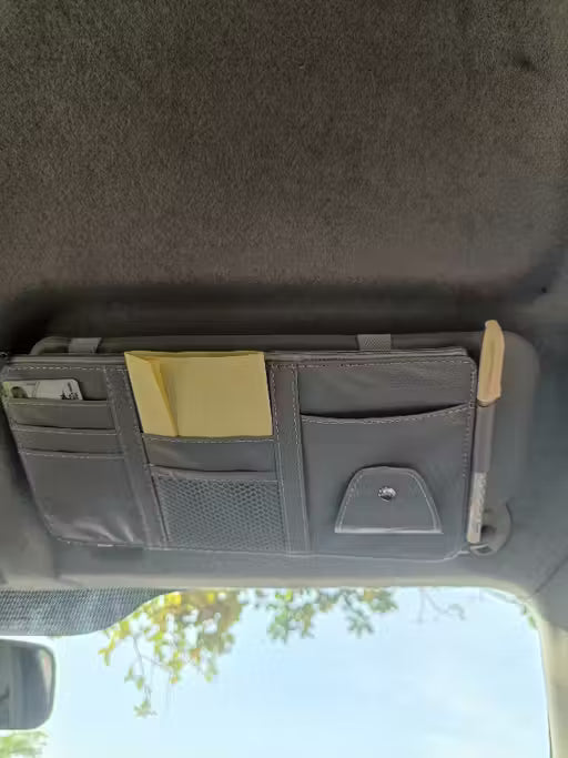 Premium Car Sun Visor organizer with multiple pockets on a car dashboard