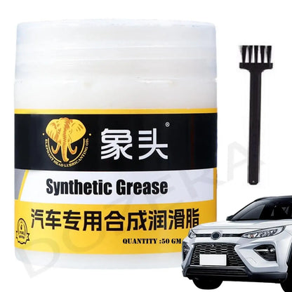 Jar of synthetic grease with a brush and car in the background