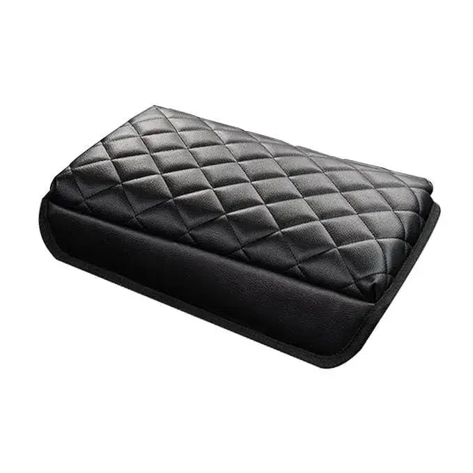 Black quilted pillow on a white background