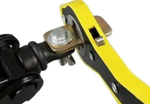 Close-up of a mechanical component with yellow handle and metal parts.