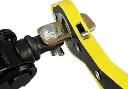 Close-up of a mechanical component with yellow handle and metal parts.